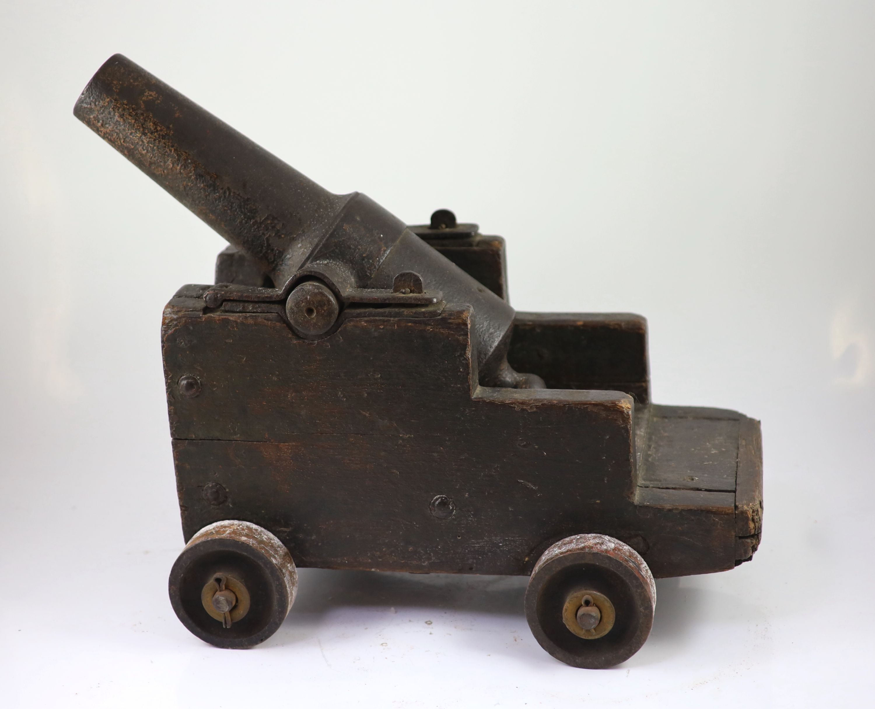 A cast iron starting cannon, probably 18th/19th century, H 35cm. L 59cm. D 31cm.